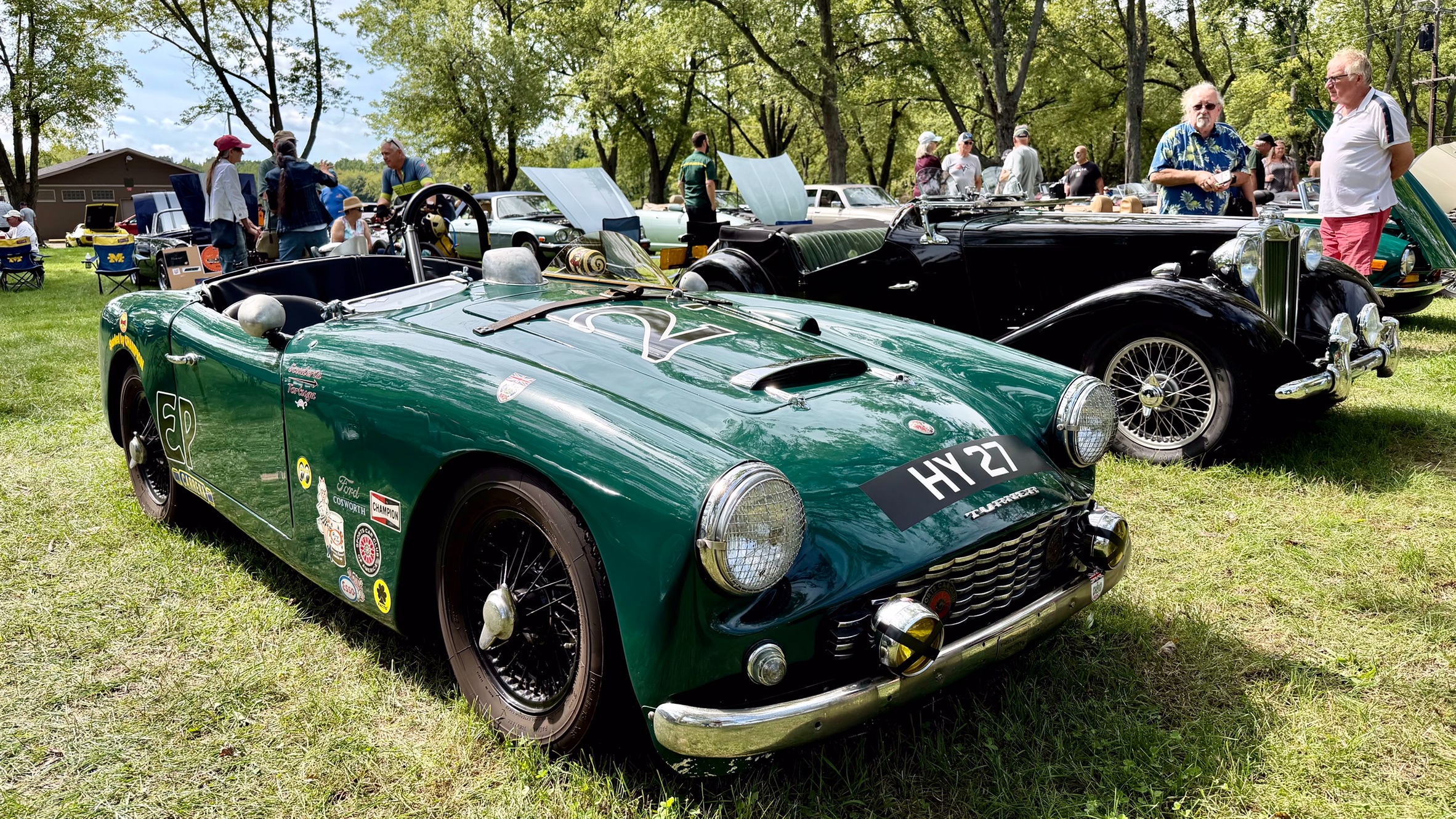 Photograph of a green 1963 Turner Mark III roadster in racing livery.